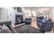 Well-lit living room featuring modern furnishings and a decorative fireplace at 240 Renaissance Ne Pkwy # 106, Atlanta, GA 30308