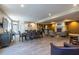 Community lounge area with a fireplace, a dining area, seating and a kitchenette at 240 Renaissance Ne Pkwy # 106, Atlanta, GA 30308