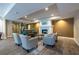 This community lounge area has a fireplace, comfortable seating, and a convenient kitchenette at 240 Renaissance Ne Pkwy # 106, Atlanta, GA 30308