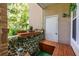 Cozy outdoor balcony with seating and views of lush greenery at 240 Renaissance Ne Pkwy # 106, Atlanta, GA 30308