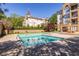 Inviting outdoor pool area with city view and manicured landscaping at 240 Renaissance Ne Pkwy # 106, Atlanta, GA 30308