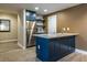Finished basement featuring a stylish wet bar with bar-top seating and a full size refrigerator at 240 Renaissance Ne Pkwy # 106, Atlanta, GA 30308