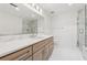 Bright bathroom with a double sink vanity, and a glass shower at 3235 Roswell Ne Rd # 421, Atlanta, GA 30305
