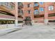 Brick building entrance with covered entry and parking garage access at 3235 Roswell Ne Rd # 421, Atlanta, GA 30305