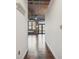 Hallway leading to living area with hardwood floors and industrial ceiling at 3235 Roswell Ne Rd # 421, Atlanta, GA 30305