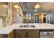 Close up of the kitchen with white counters and wooden accent wall at 3235 Roswell Ne Rd # 421, Atlanta, GA 30305