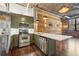 Spacious kitchen with stainless steel appliances and eat-in kitchen island at 3235 Roswell Ne Rd # 421, Atlanta, GA 30305