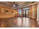 Living room with exposed brick, hardwood floors, and updated fixtures at 3235 Roswell Ne Rd # 421, Atlanta, GA 30305