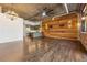 Open-concept living room with wood accent wall and modern appliances at 3235 Roswell Ne Rd # 421, Atlanta, GA 30305