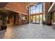 Welcoming lobby with high ceilings, brick wall, and tile floors at 3235 Roswell Ne Rd # 421, Atlanta, GA 30305