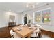 Open dining area with hardwood floors, natural light, and modern chandelier at 5805 Clarion St., Cumming, GA 30040
