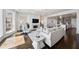 Open-concept living room with hardwood floors, fireplace, and modern decor at 5805 Clarion St., Cumming, GA 30040