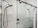 Modern walk-in shower with dual shower heads, glass doors, and marble style tile surround at 1112 Park S Row, Atlanta, GA 30312