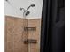 Comfortable bathroom with shower and tub combination featuring tiled accent wall and black shower curtain at 1112 Park S Row, Atlanta, GA 30312