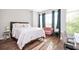 Bright bedroom with large windows, comfortable bed, and minimalist decor at 1112 Park S Row, Atlanta, GA 30312