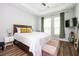 Serene bedroom featuring a comfortable bed, stylish furniture, and ample natural light at 1112 Park S Row, Atlanta, GA 30312