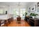 Open-concept dining area with bar seating, modern decor, and natural light creating a welcoming atmosphere at 1112 Park S Row, Atlanta, GA 30312