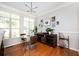 Bright and airy dining area with a glass-top table, modern lighting, and stylish wall decor at 1112 Park S Row, Atlanta, GA 30312