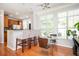 Inviting dining area with bar seating, a sleek chandelier, and abundant natural light at 1112 Park S Row, Atlanta, GA 30312