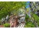 Charming townhome exterior with brick accents, white trim, and lush greenery at 1112 Park S Row, Atlanta, GA 30312