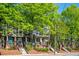 Charming townhomes with brick accents, stairs, and lush green trees at 1112 Park S Row, Atlanta, GA 30312