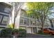 Charming townhome with a gray exterior, attached garage, and well-maintained landscaping in a desirable neighborhood at 1112 Park S Row, Atlanta, GA 30312