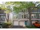 Attractive townhome exterior with two-car garage, modern facade, and inviting curb appeal at 1112 Park S Row, Atlanta, GA 30312