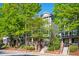 Charming townhomes with brick accents, stairs, and lush green trees at 1112 Park S Row, Atlanta, GA 30312