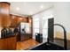 Modern kitchen with stainless steel refrigerator, granite countertops, and wood floors at 1112 Park S Row, Atlanta, GA 30312