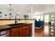 Modern kitchen area with granite counters, stainless steel appliances, and seamless access to the living room at 1112 Park S Row, Atlanta, GA 30312