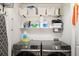 Functional laundry room with shelving, storage, and front-loading washer and dryer at 1112 Park S Row, Atlanta, GA 30312