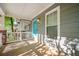 Inviting front porch with blue door, white railings, and ample natural light at 1112 Park S Row, Atlanta, GA 30312