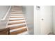 Wooden staircase with white risers leading to the upper level of the home at 1112 Park S Row, Atlanta, GA 30312