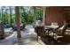 Inviting back patio with outdoor seating, a grill, and lush greenery, ideal for relaxing and entertaining guests at 2698 Bonar Hall Path, Duluth, GA 30097