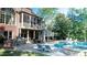 Backyard exterior with a pool, spa, and an outdoor kitchen, complemented by a cozy screened-in porch at 2698 Bonar Hall Path, Duluth, GA 30097