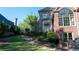 Backyard features a stone staircase leading to upper yard, complemented by manicured lawn and shrubbery at 2698 Bonar Hall Path, Duluth, GA 30097