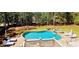 Stunning backyard with a refreshing pool, relaxing spa, and manicured landscaping, ideal for leisure at 2698 Bonar Hall Path, Duluth, GA 30097