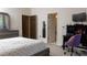 Comfortable bedroom with a gray color scheme, ample closet space, and a dedicated workspace for productivity at 2698 Bonar Hall Path, Duluth, GA 30097