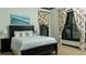 Inviting bedroom features neutral tones, a comfortable bed, and large windows, providing a peaceful sanctuary at 2698 Bonar Hall Path, Duluth, GA 30097