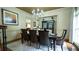 Formal dining room with a decorative rug, wainscoting, and a chandelier at 2698 Bonar Hall Path, Duluth, GA 30097