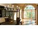 Elegant dining room with hardwood floors, large windows, and a decorative chandelier, creating a bright and inviting atmosphere at 2698 Bonar Hall Path, Duluth, GA 30097