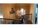 Grand two-story foyer with decorative chandelier, arched window, and dark wood staircase at 2698 Bonar Hall Path, Duluth, GA 30097
