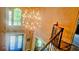Bright, two-story foyer with decorative chandelier, large windows, and decorative front door at 2698 Bonar Hall Path, Duluth, GA 30097
