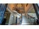 Grand foyer with a soaring ceiling, hardwood floors, and a curved staircase with wrought iron railings at 2698 Bonar Hall Path, Duluth, GA 30097