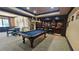 Well-appointed game room with a pool table, bar area, and seating, perfect for entertaining guests at 2698 Bonar Hall Path, Duluth, GA 30097
