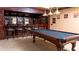 Well-appointed game room with a pool table, bar area, and seating, ideal for relaxation and entertainment at 2698 Bonar Hall Path, Duluth, GA 30097