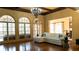 Bright living room with hardwood floors, white sofa, and views of the outdoors at 2698 Bonar Hall Path, Duluth, GA 30097