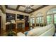 Bright living room with hardwood floors, coffered ceilings, a fireplace, and large windows with natural light at 2698 Bonar Hall Path, Duluth, GA 30097