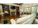 Cozy living room with fireplace, built-in bookshelves, and a large sofa bathed in natural light at 2698 Bonar Hall Path, Duluth, GA 30097