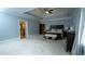 Large main bedroom with a tray ceiling, sitting area, and ample closet space at 2698 Bonar Hall Path, Duluth, GA 30097